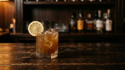 Absolute Suicide cocktail in a rocks glass with a lemon wheel