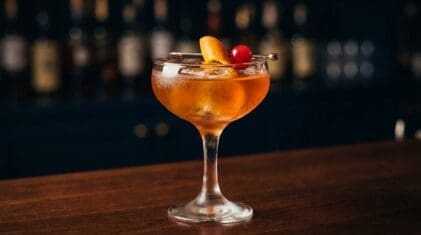 Amaretto Sweet and Sour cocktail in coupe glass
