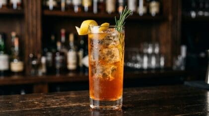 Arctic Punch cocktail in tall highball glass with ice