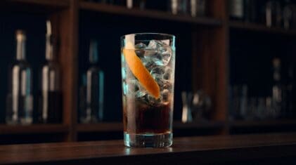Aztec Punch cocktail in tall highball glass with ice