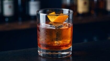 Campari Beer cocktail in rocks glass with clear ice