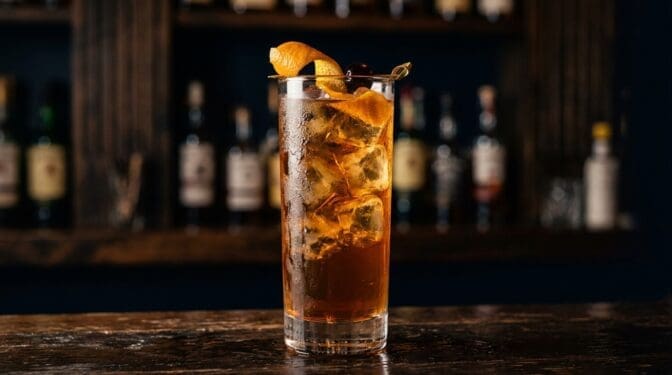 Fruit And Sherbet Punch cocktail in tall highball glass with ice