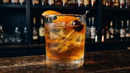Gluehwein cocktail in rocks glass with clear ice