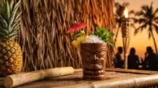 Mai Tai in a tiki mug at a tropical beach bar